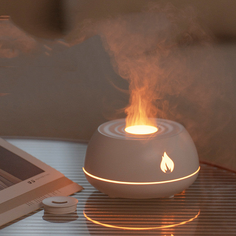 White flame-shaped diffuser on a table with a blurred background