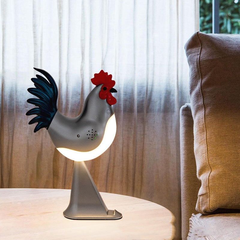 Rooster-shaped night light on a table with a blurred background