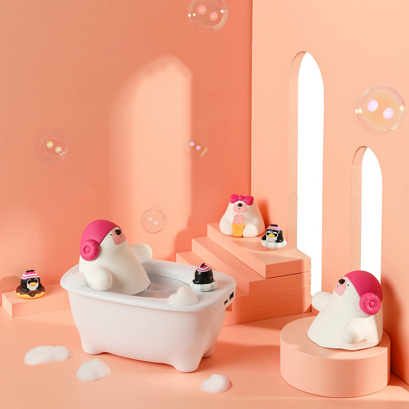 Cute animal-themed product setup with a bathtub and bubbles on a pink background