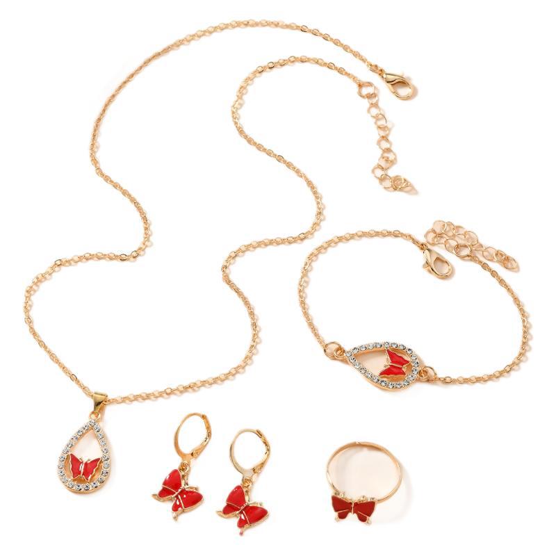 Jewelry set with necklace, bracelet, earrings, and ring on a white background