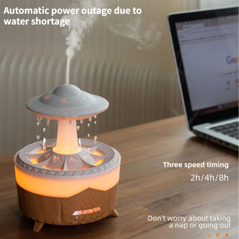 Desk with a UFO-shaped humidifier emitting steam, next to a laptop.
