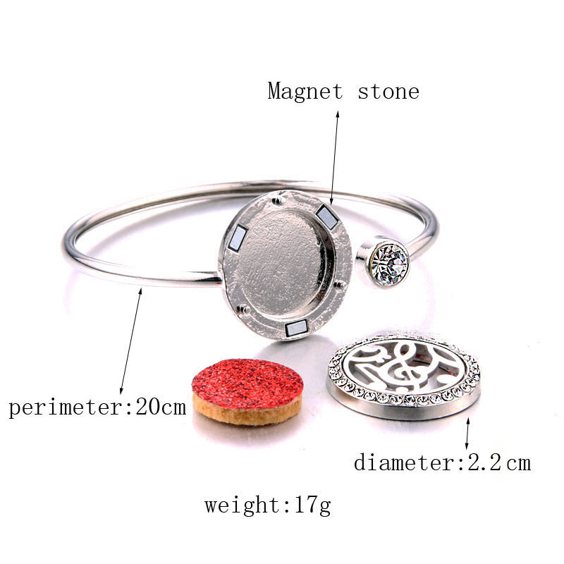 Silver bracelet with a magnetic stone and cork stopper, labeled with measurements.