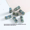 Set of cylindrical ceramic beads with blue and green stripes on a white background.