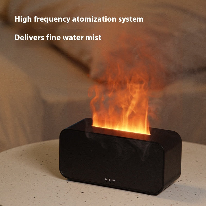 Black high-frequency atomization system emitting a fine water mist with flames on a blurred background.