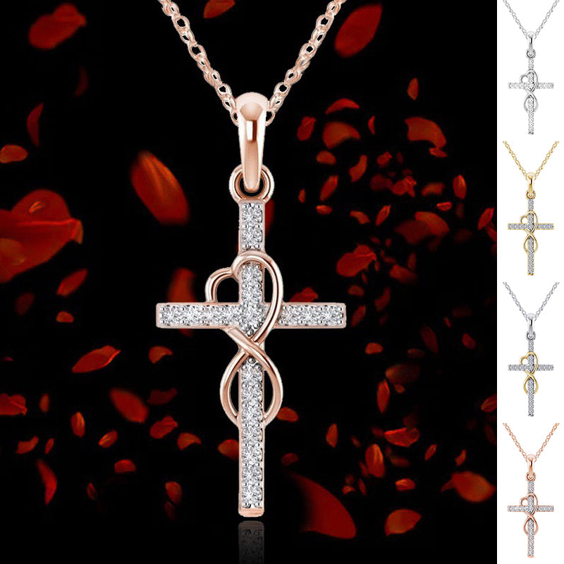 Rose gold cross pendant necklace with diamond accents on a dark background with red rose petals.