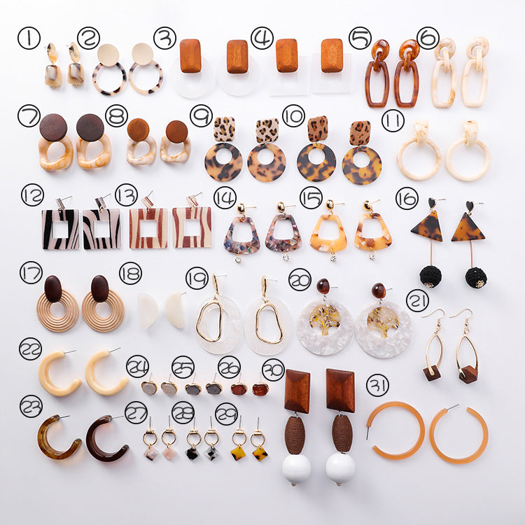 Collection of various earrings on a white background