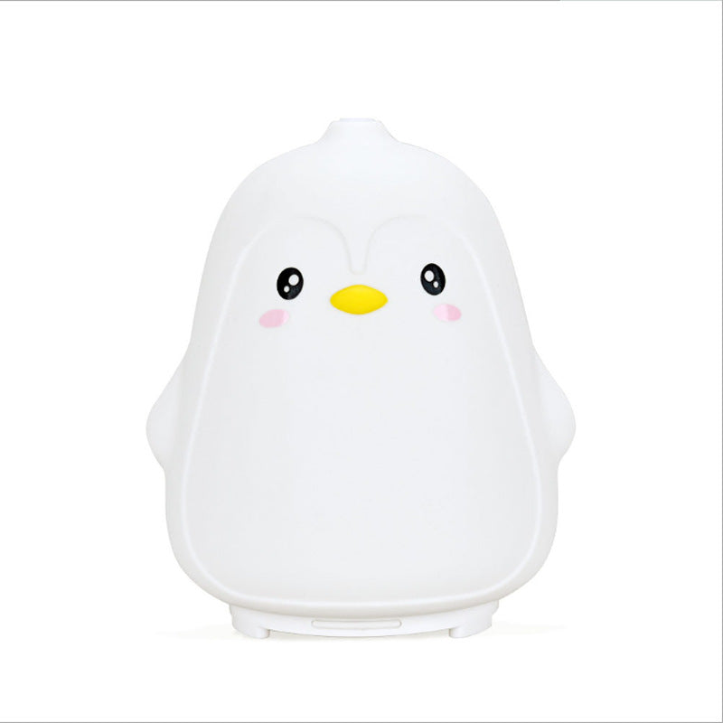 Cute penguin-shaped night light on a white background