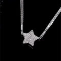Star-shaped pendant necklace on a black background