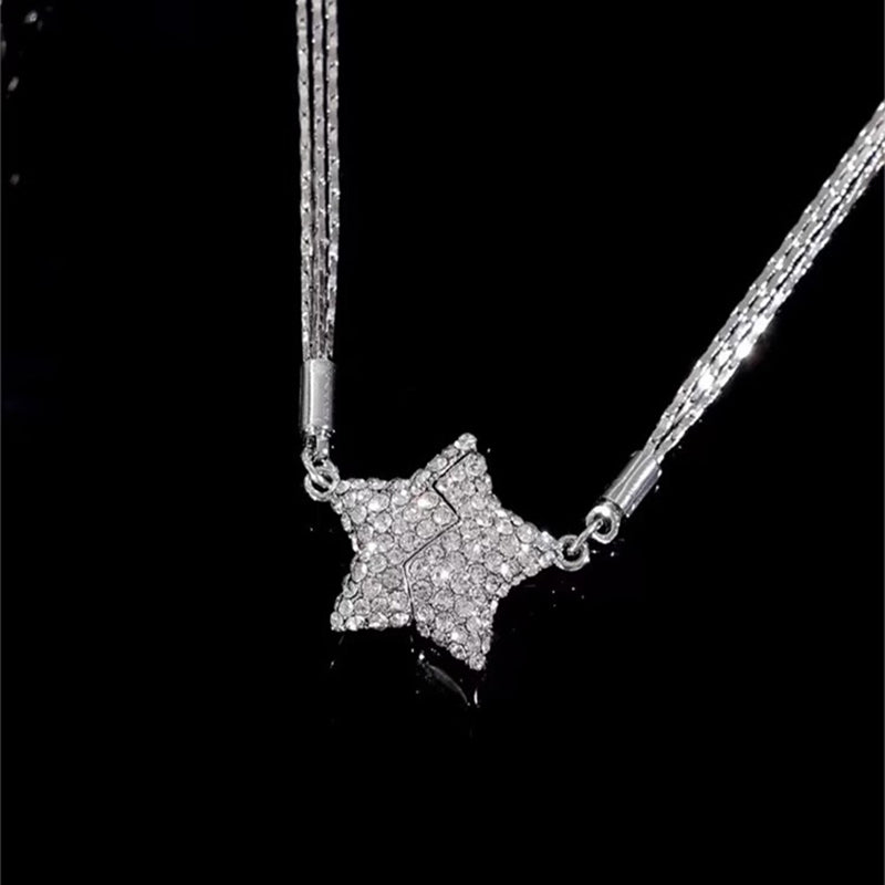 Star-shaped pendant necklace on a black background