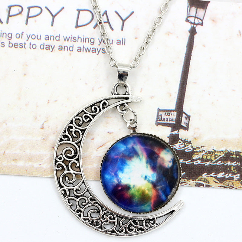 Necklace with a colorful galaxy pendant on a decorative background