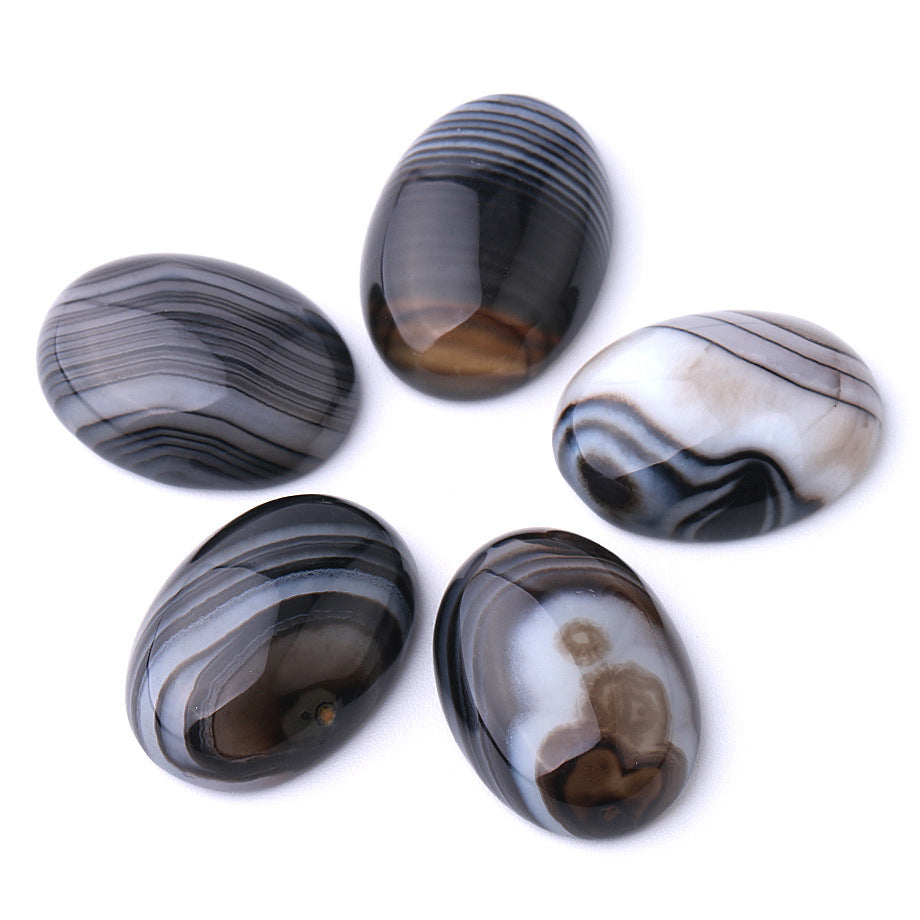 Five patterned stones on a white background