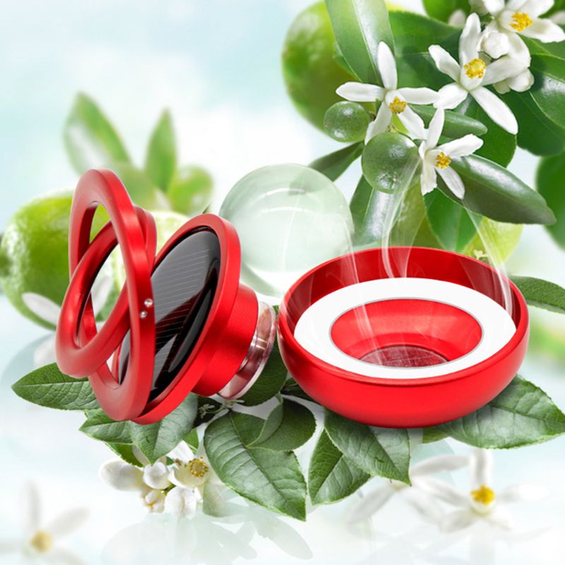 Red and clear diffuser on a green leafy background with white flowers