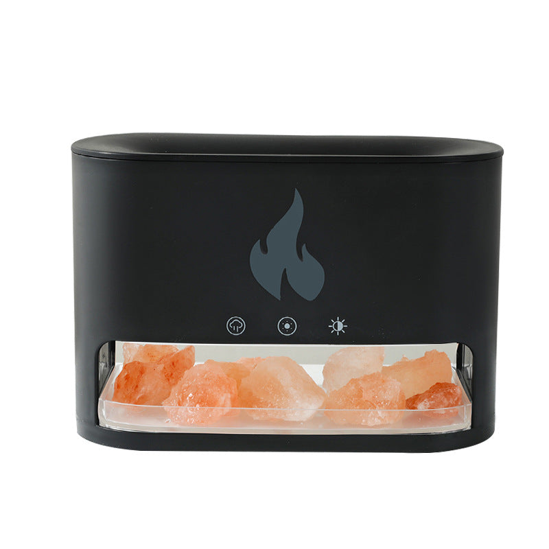 Black electronic device with a flame icon and pink Himalayan salt crystals on a white background