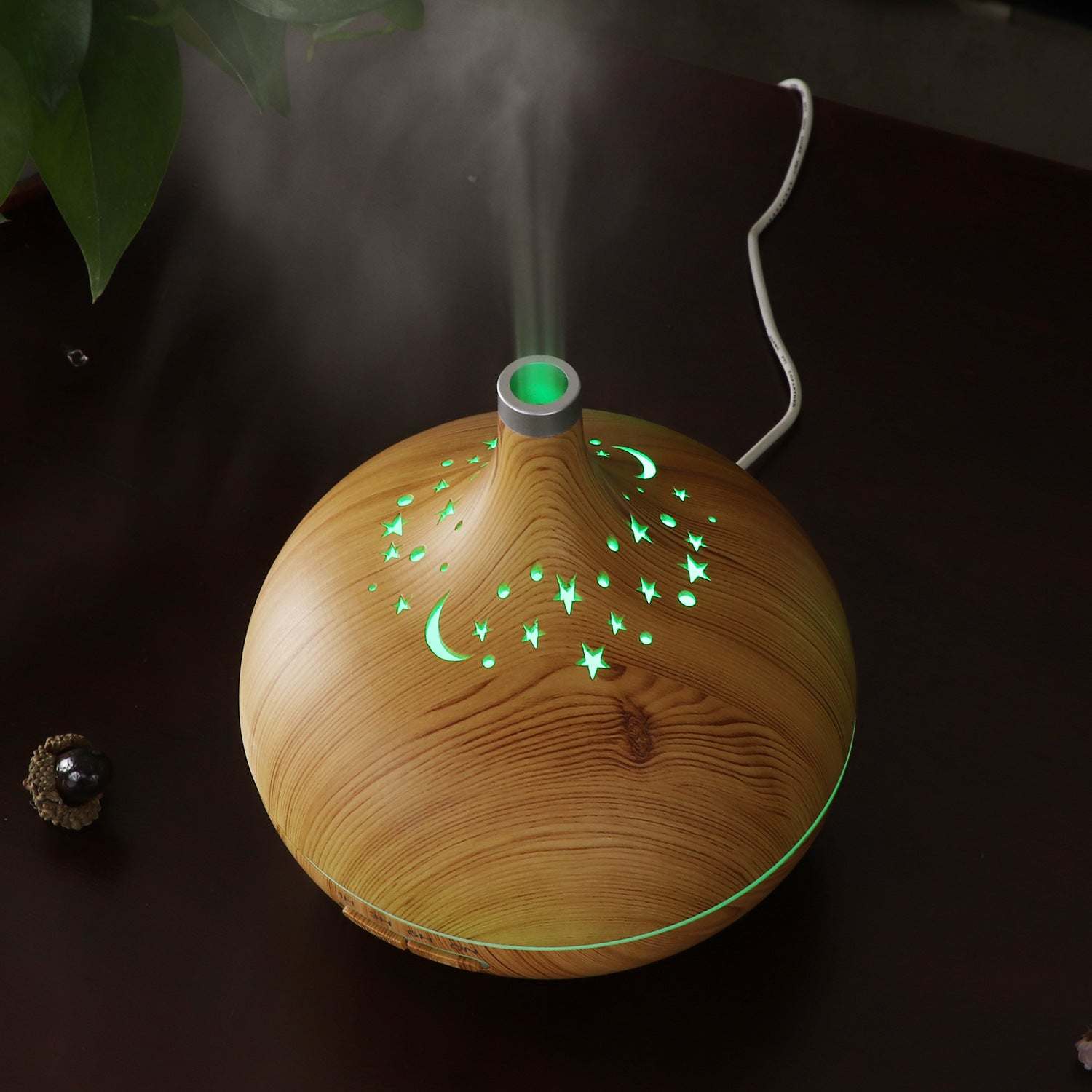 Wooden diffuser emitting mist with a dark background
