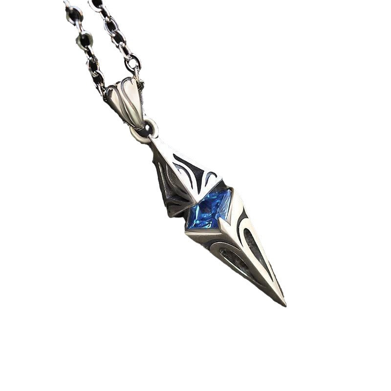 Silver pendant with blue gemstone on a white background