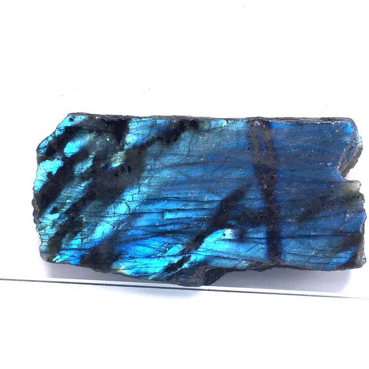Blue and black labradorite stone on a white background