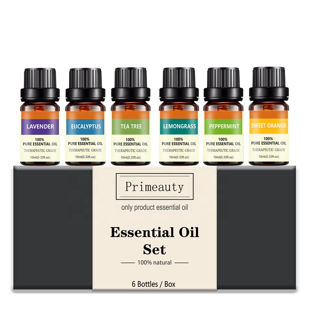 Set of six essential oil bottles with labels on a white background