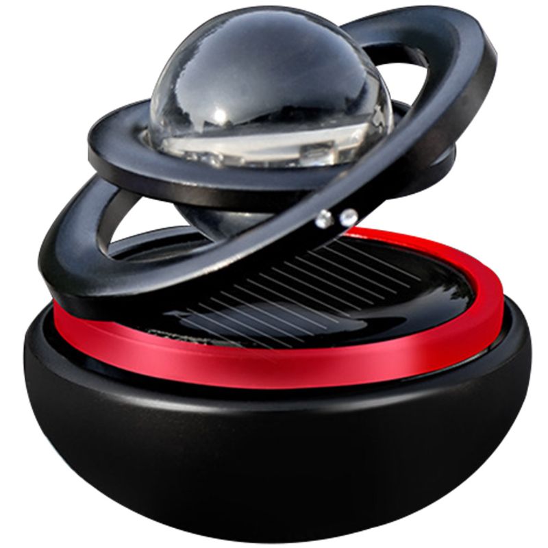 Black and red device with a transparent sphere on a white background