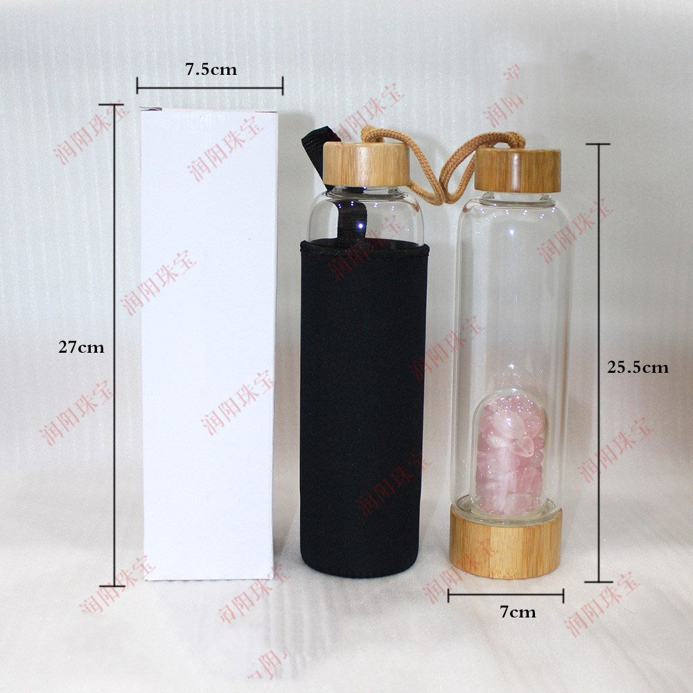 Clear glass bottle with wooden cap and black sleeve, dimensions labeled