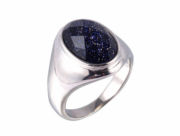 Silver ring with a blue gemstone on a white background