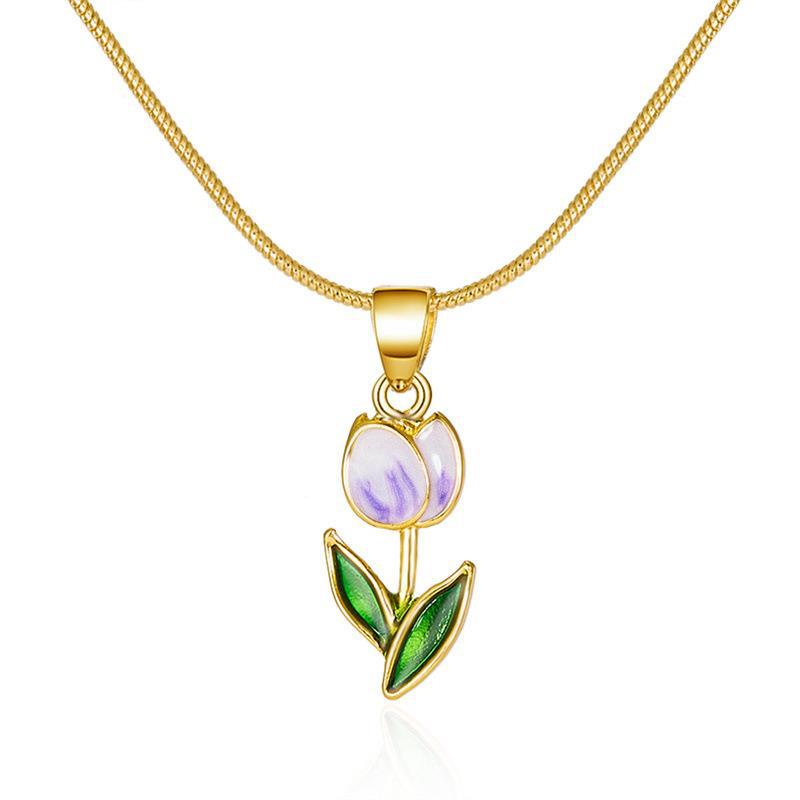 Gold necklace with a tulip-shaped pendant on a white background