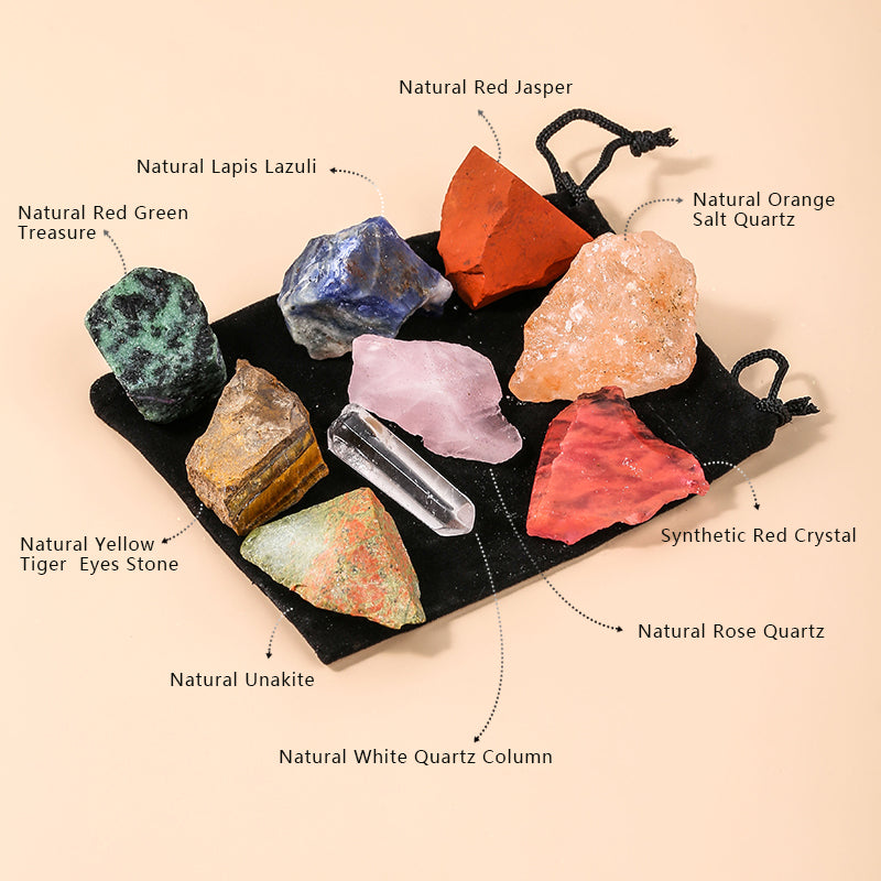 Collection of various crystals on a black mat with labels on a beige background