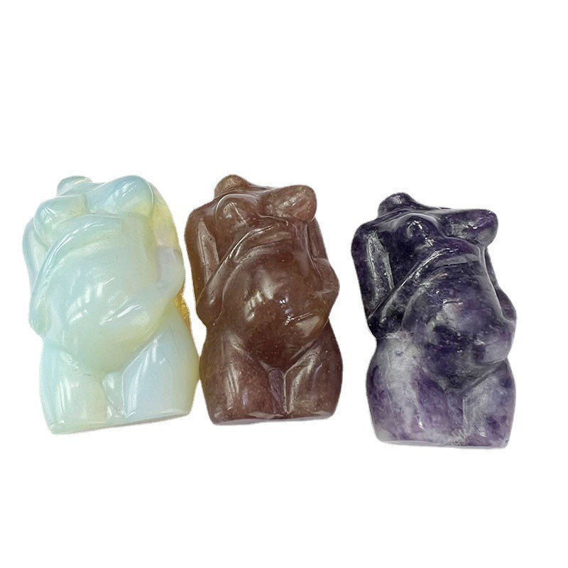 Three crystal animal figurines in different colors on a white background
