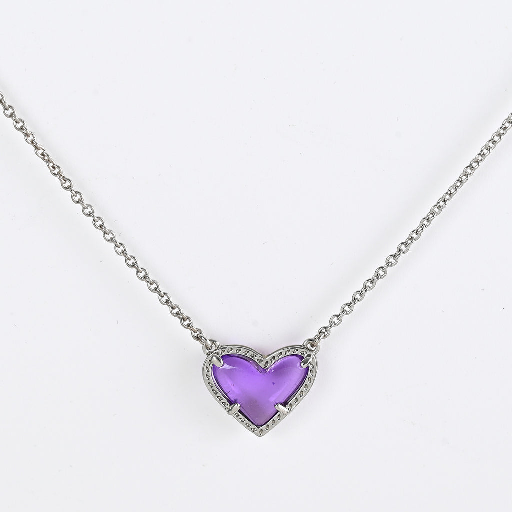 Necklace with a purple heart-shaped pendant on a white background