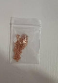 Small bag with gold jewelry on a white background