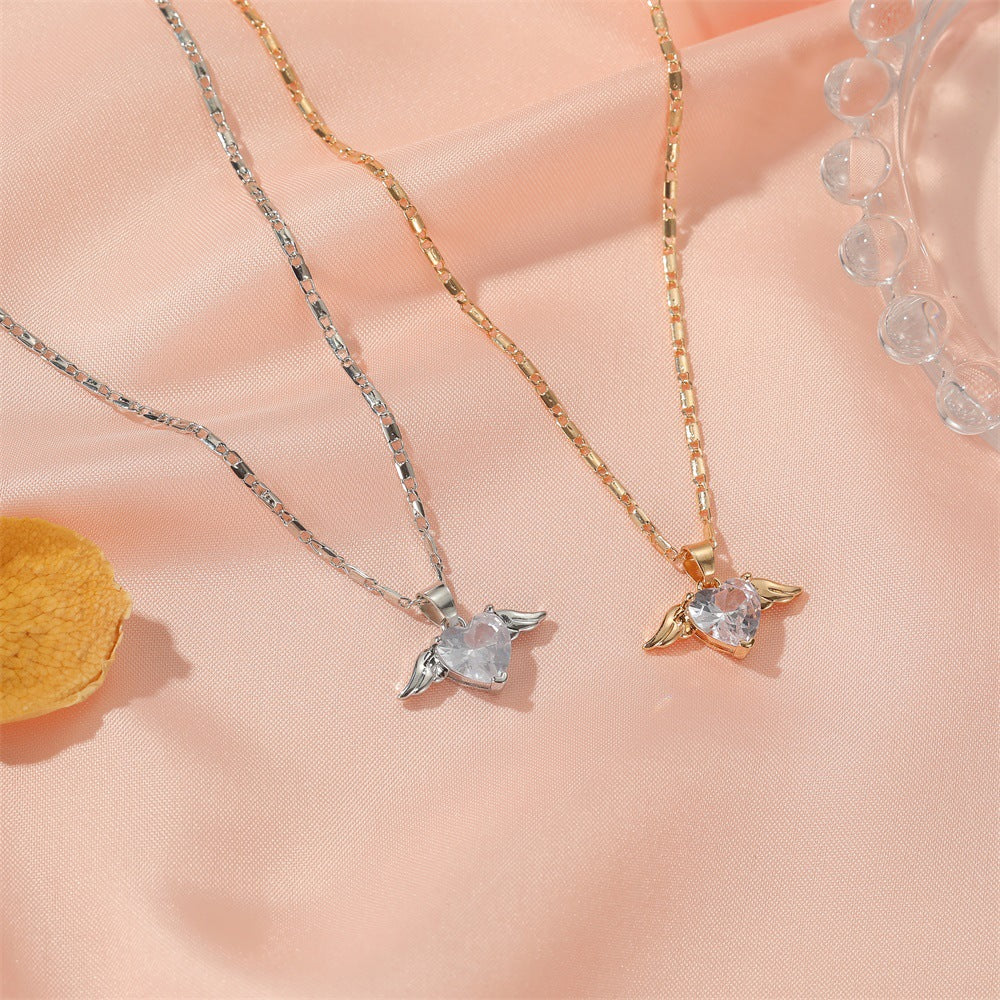 Two necklaces with heart-shaped pendants on a soft pink background
