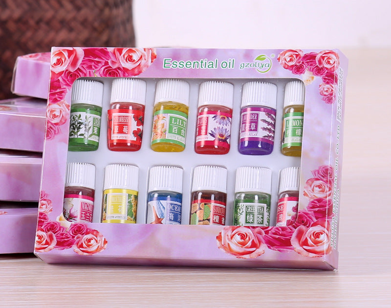 Set of gzollya essential oils in a decorative box with floral design