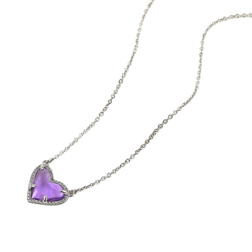 Necklace with a heart-shaped purple pendant on a white background