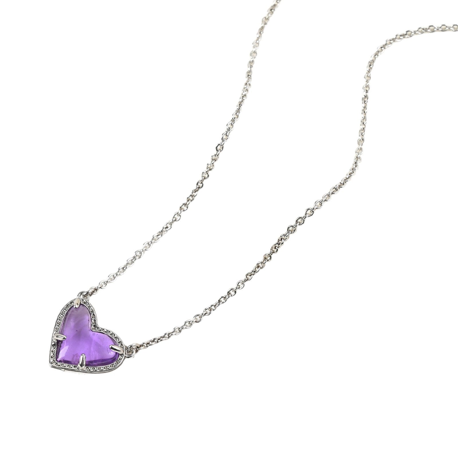 Necklace with a heart-shaped purple pendant on a white background