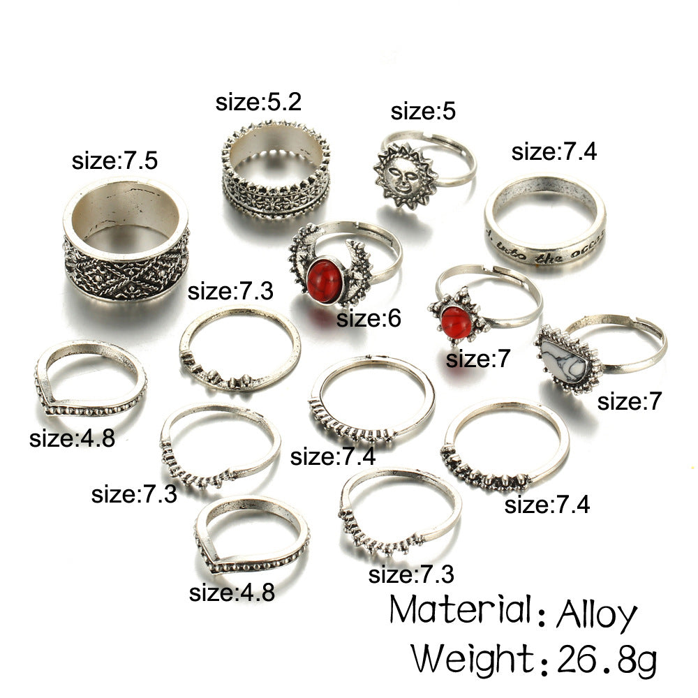 Collection of silver rings with various designs and sizes on a white background.