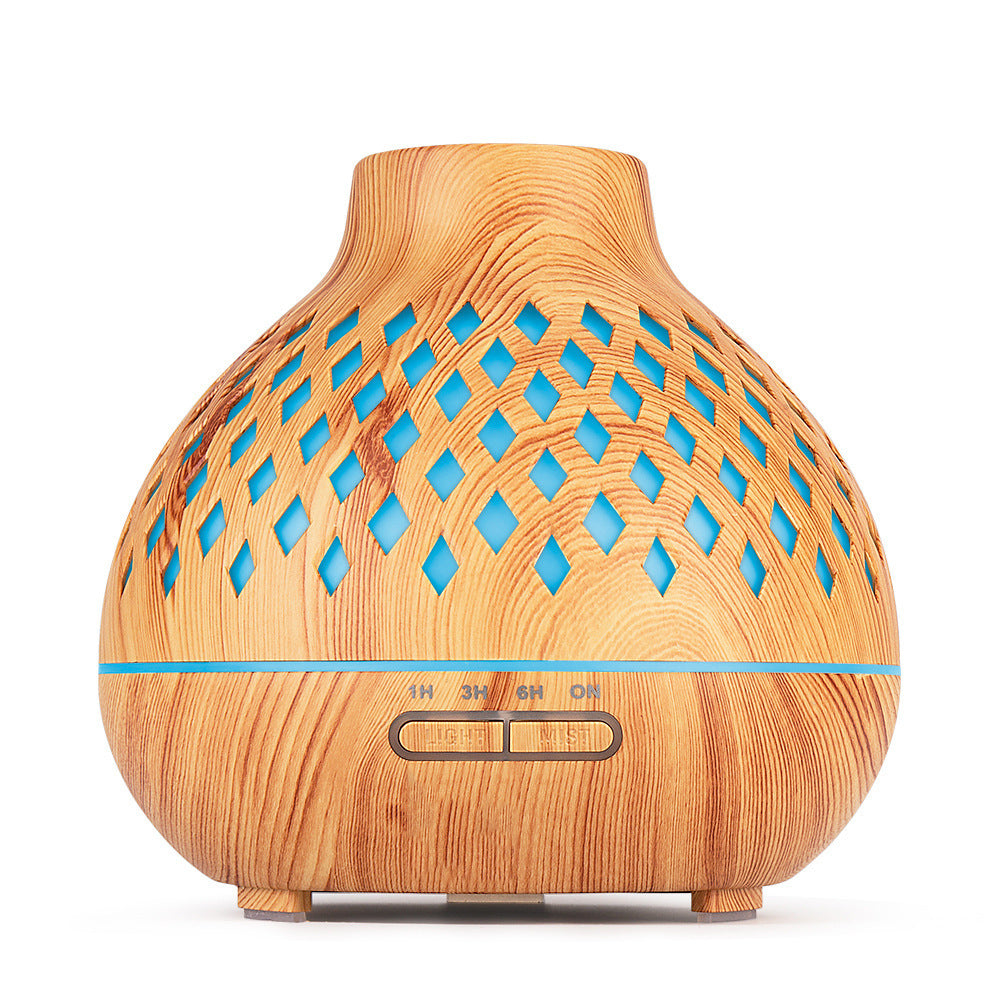 Wooden diffuser with blue accents on a white background