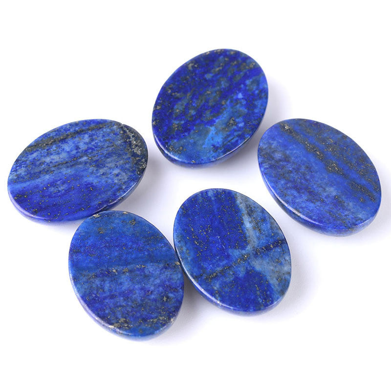 Five blue oval stones on a white background