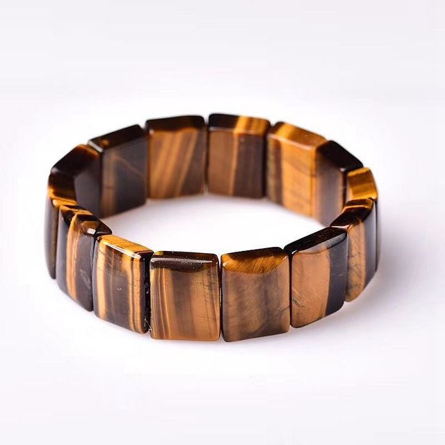 Brown and black striped bracelet on a white background