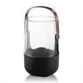 Black and bronze portable lantern with glass container on a white background