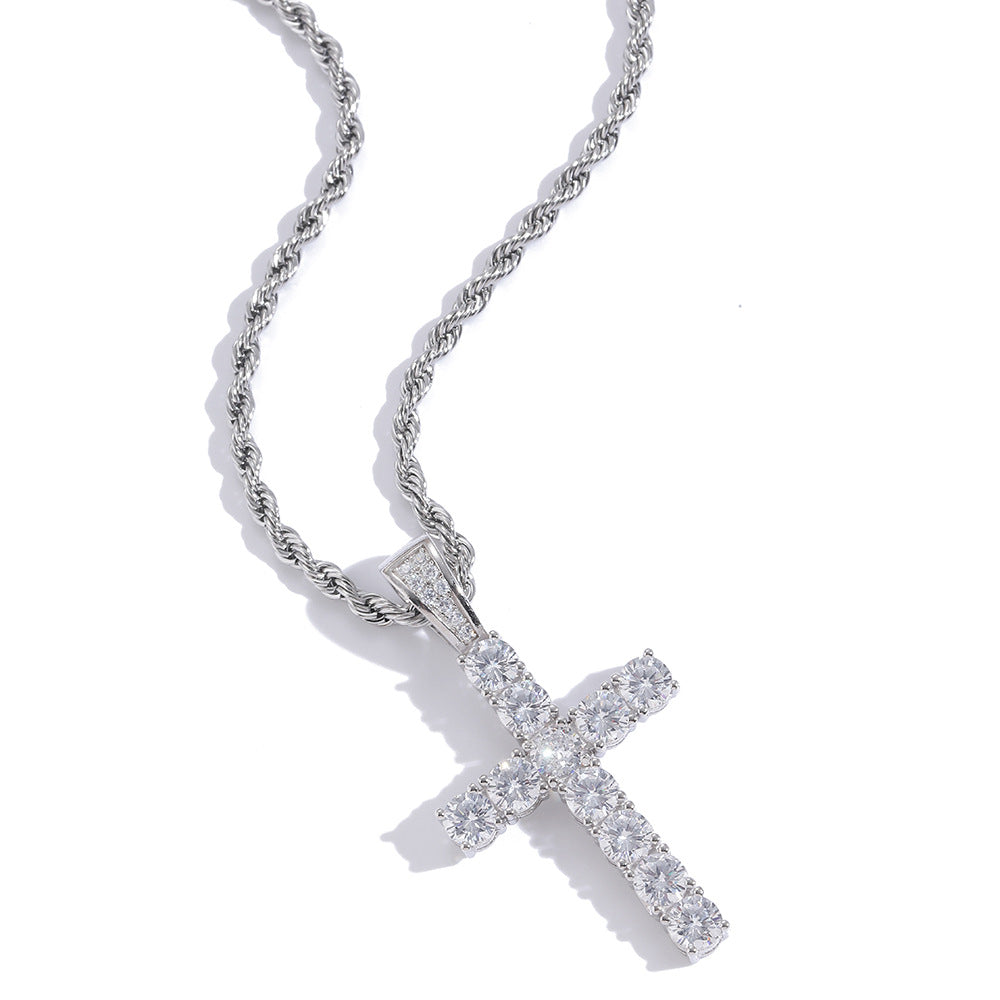 Silver cross pendant necklace on a white background