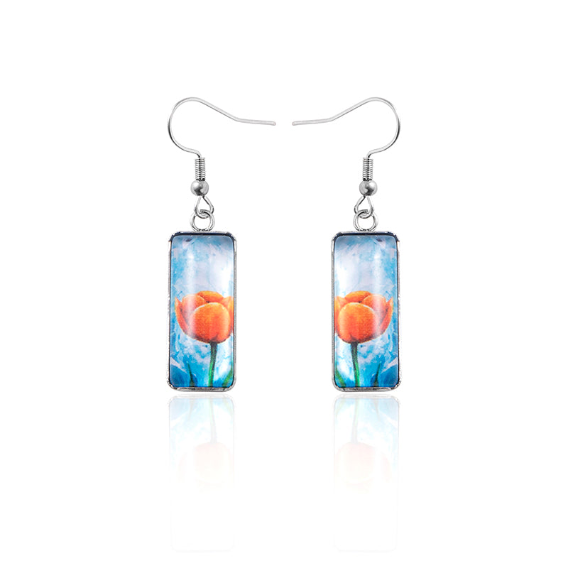 Rectangular earrings with floral design on a white background