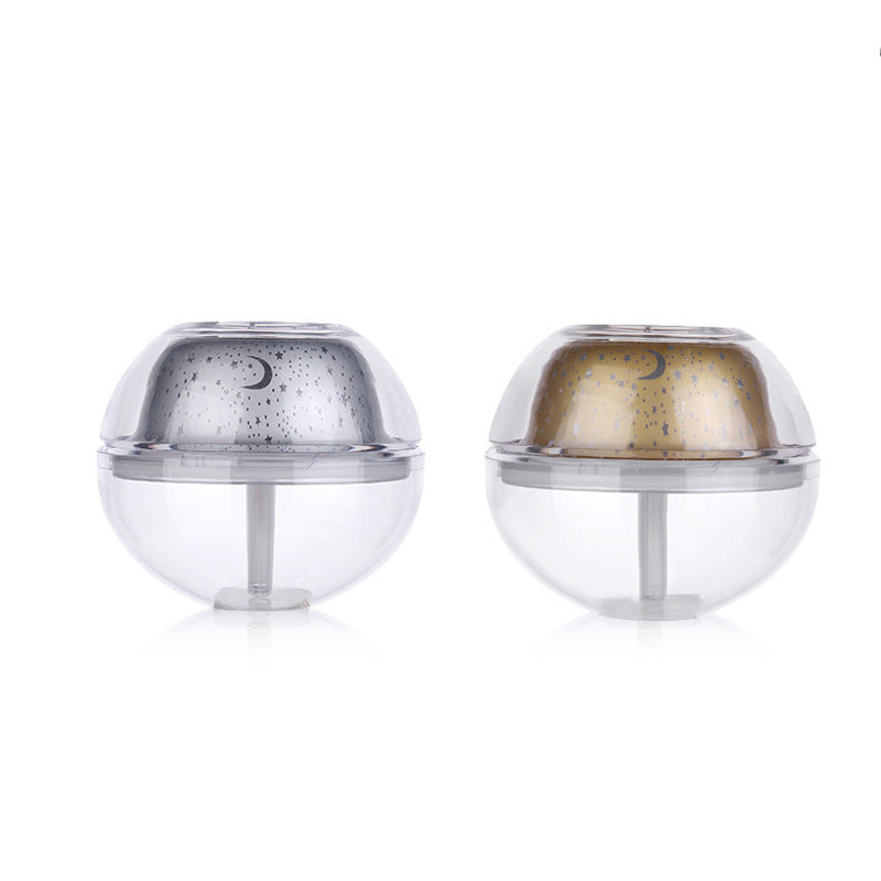 Two transparent spherical containers with metallic tops on a white background