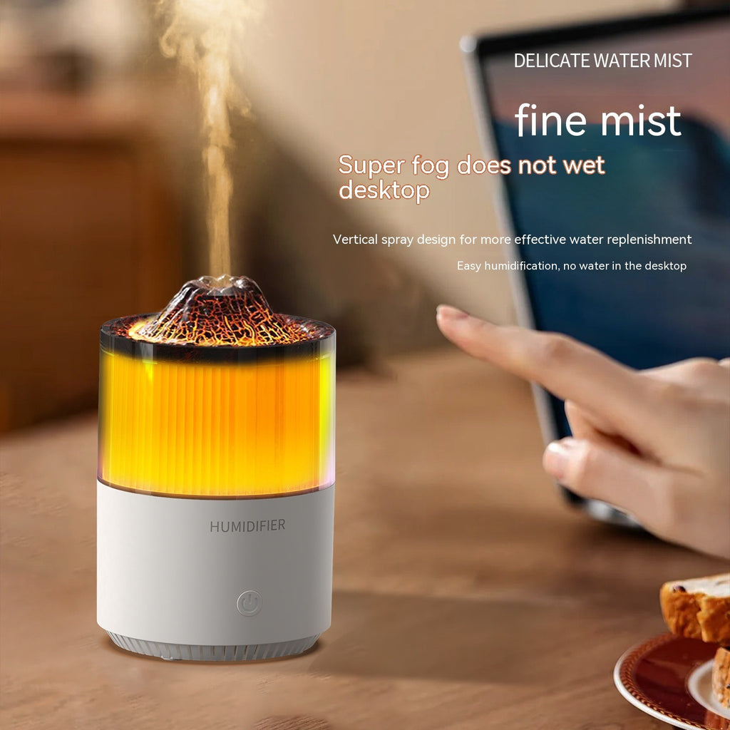 Humidifier emitting mist on a desk with a phone and food item in the background