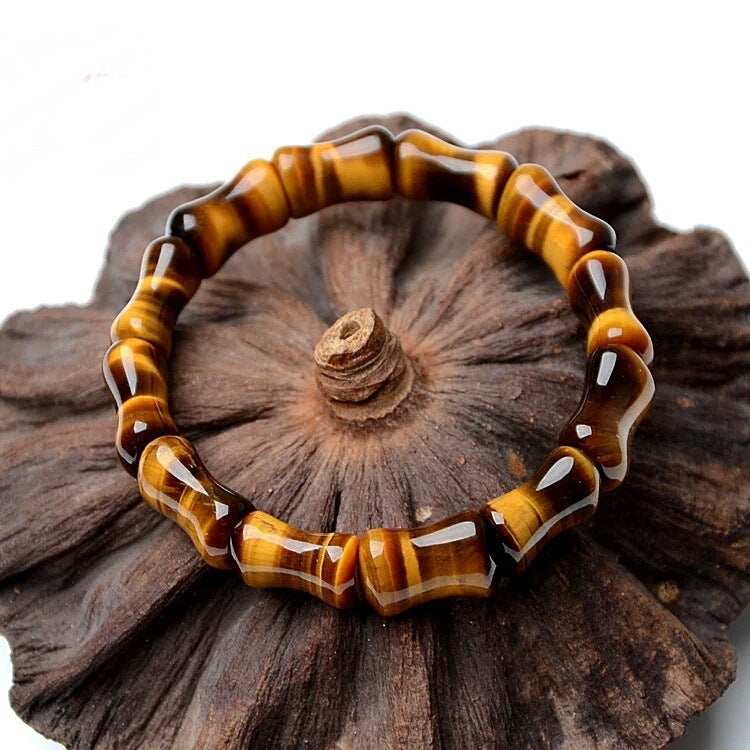 Tiger eye bracelet on a wooden surface