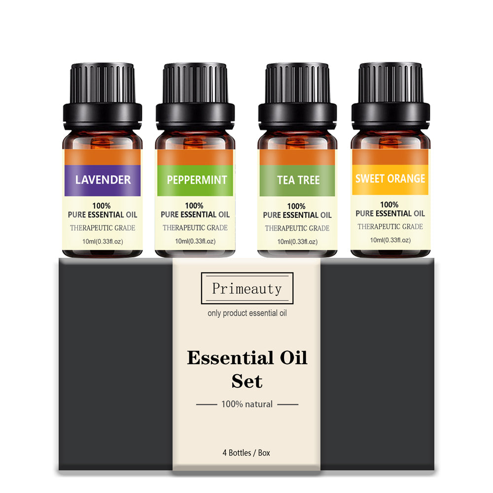 Set of four essential oil bottles with labels on a white background