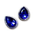 Pair of blue teardrop earrings with clear gemstones on a white background