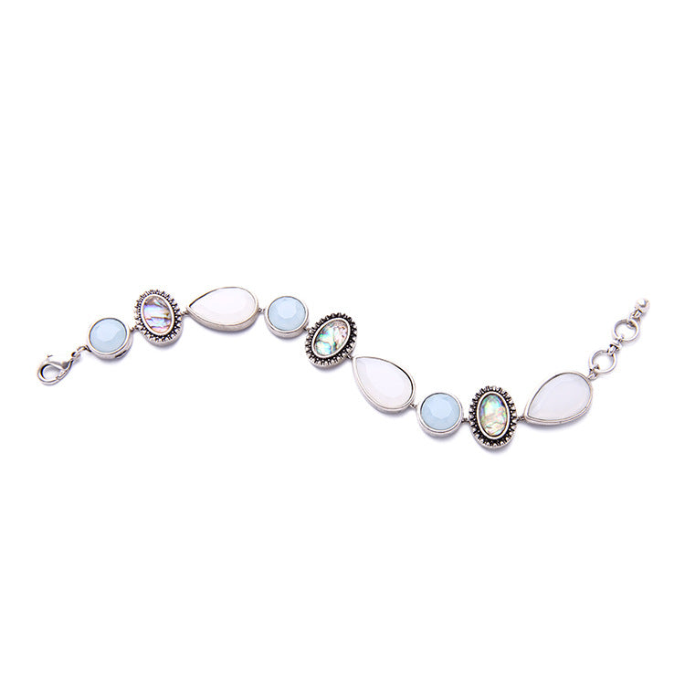 Bracelet with multicolored gemstones on a white background