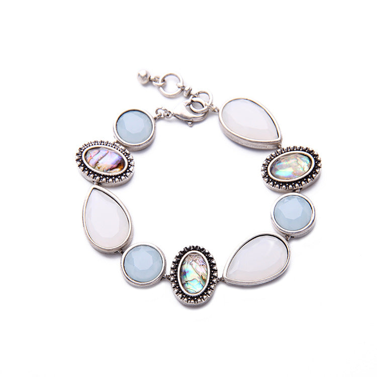 Bracelet with multicolored gemstones on a white background