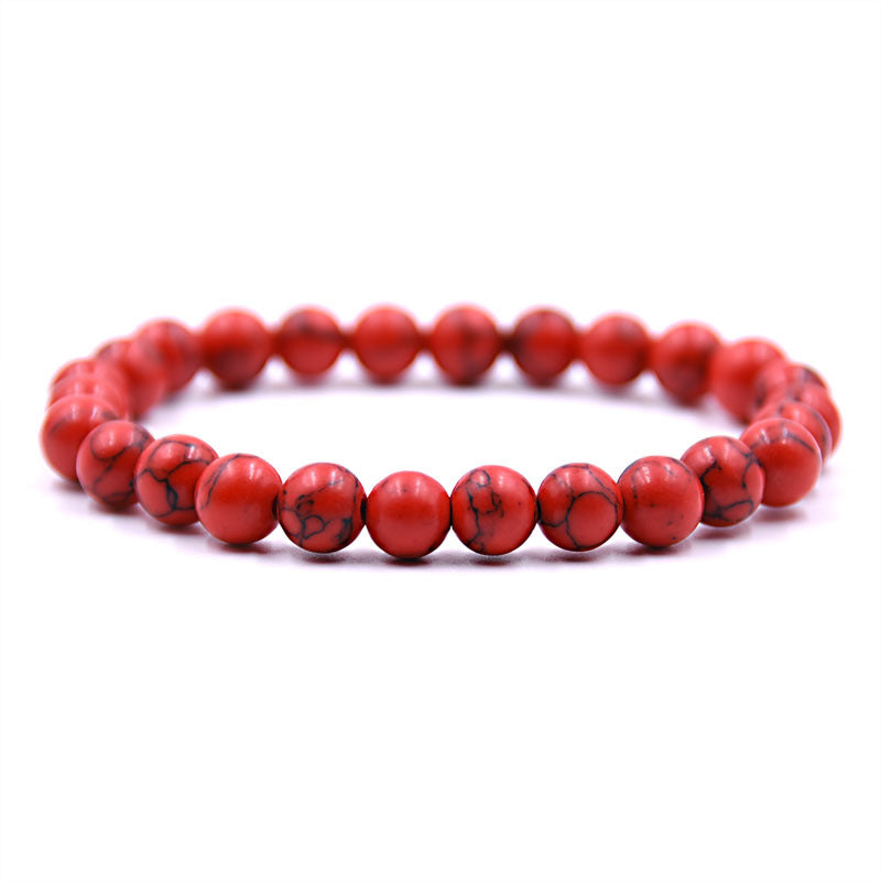 Red beaded bracelet on a white background