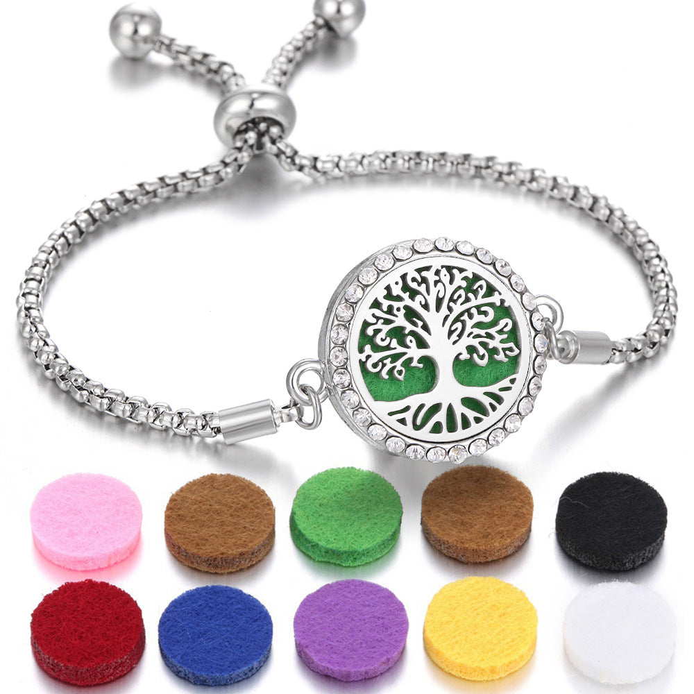 Bracelet with tree of life charm and colorful felt pads on a white background