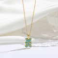 Gold necklace with a blue pendant on a white background